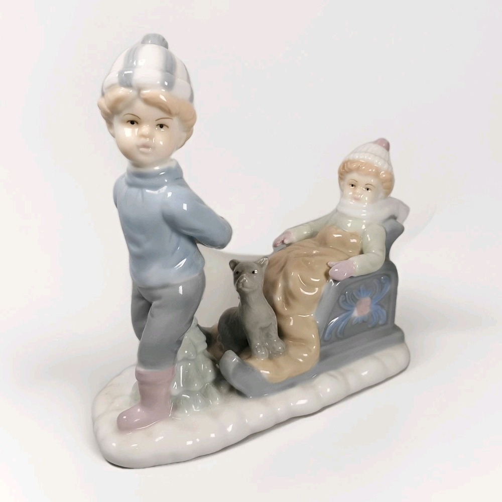Raffles Figurine CDF Canada Porcelain Boy And Girl With Sled And With Dog 7"x 8"
